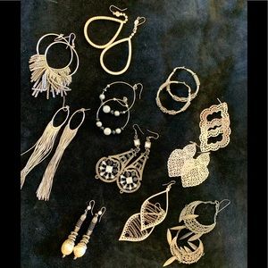 Lot of 11 pair of silver color earrings.